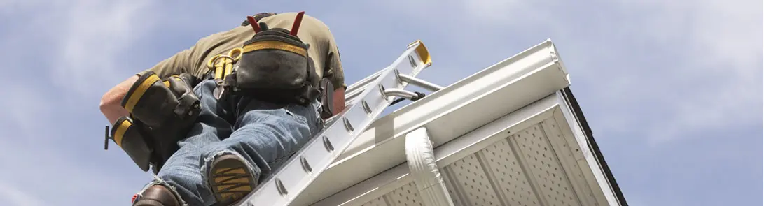 Roofer Installing Gutters